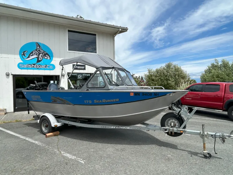 Slide: The Image of 1999 Hewescraft Sea Runner 179 boat on trailer outside Salish Boat Co. - 15