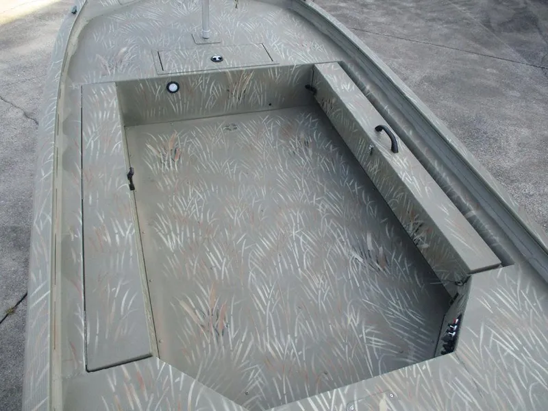 Slide: The Image of 2025 Tracker GRIZZLY® 1654 T Sportsman boat interior with camouflage pattern. - 3