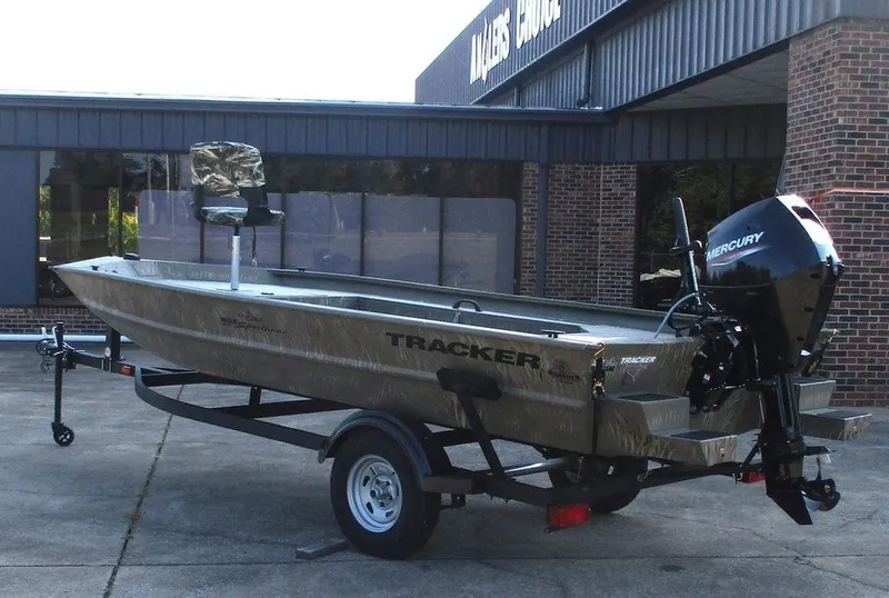 Slide: The Image of 2025 Tracker GRIZZLY® 1654 T Sportsman boat with Mercury engine on trailer. - 4