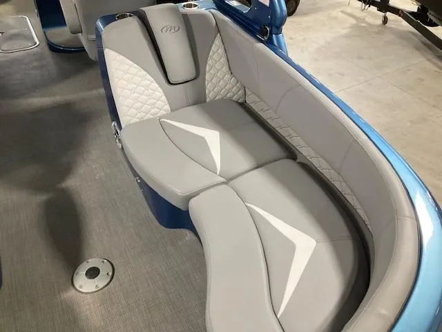 Slide: The Image of Luxurious seating in 2019 Manitou 25 Legacy LT RFXW pontoon boat, featuring elegant gray upholstery. - 10