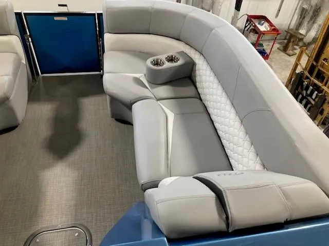 Slide: The Image of Luxurious seating on 2019 Manitou 25 Legacy LT RFXW pontoon boat with cup holders. - 5