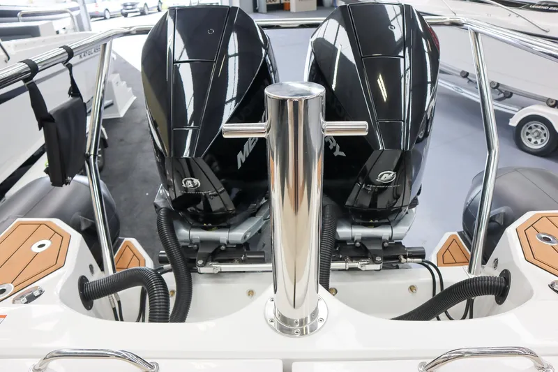 Slide: The Image of Twin Mercury outboard engines on a 2025 Protector 310 Targa boat, showcasing V8 300 HP power. - 16