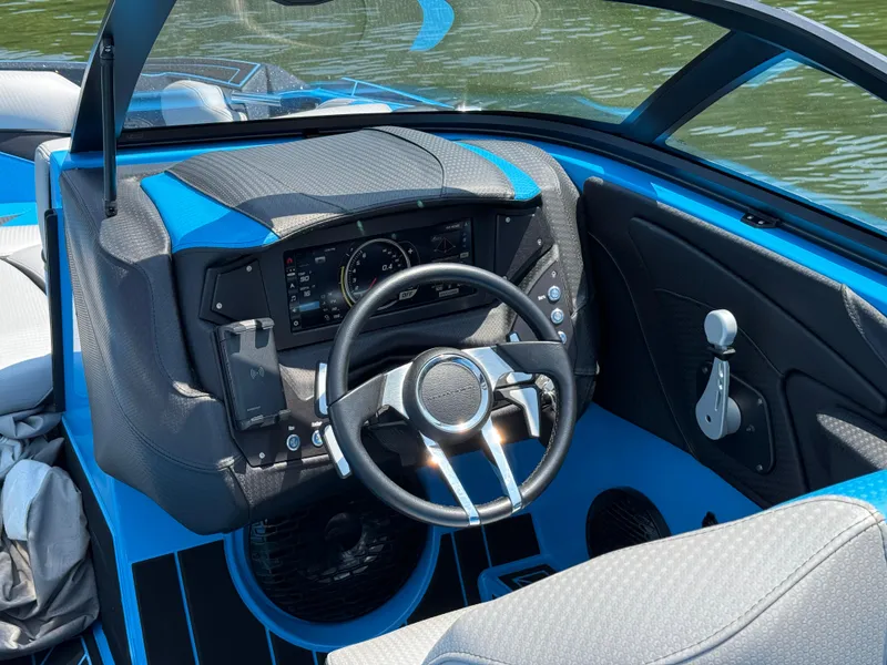 Slide: The Image of Interior view of 2022 Centurion Fi23 boat cockpit with steering wheel and dashboard. - 15