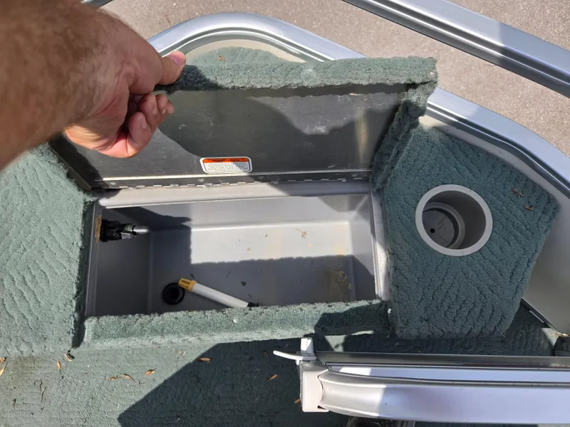 Slide: The Image of Open storage compartment on 2006 Sun Tracker FISHIN' BARGE 21 Signature Series boat. - 24