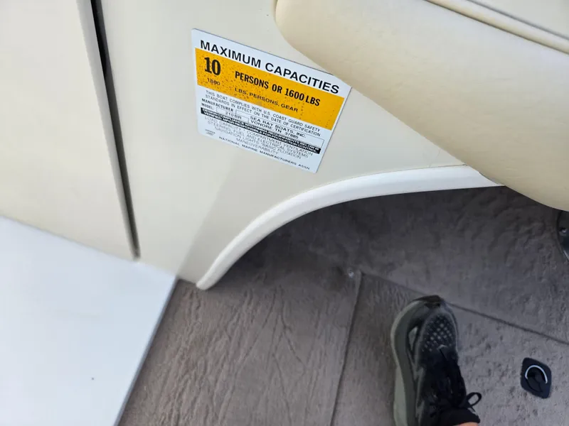 Slide: The Image of 1999 Sea Ray 210 BR boat capacity label, maximum 10 persons or 1600 lbs. - 17