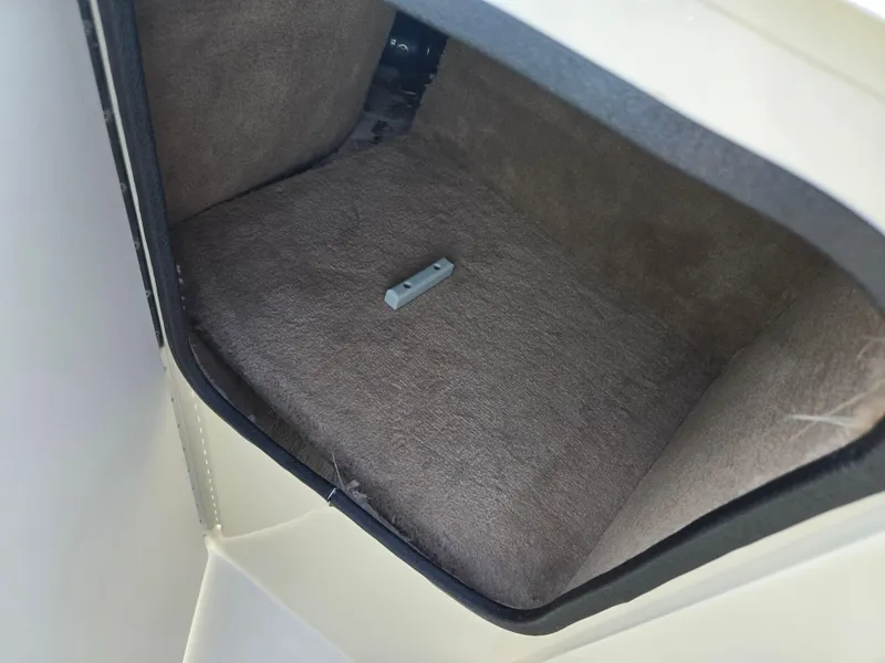 Slide: The Image of Interior storage compartment of a 1999 Sea Ray 210 BR boat. - 18