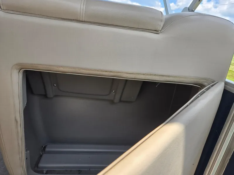 Slide: The Image of Open storage compartment on 2022 Sun Tracker Party Barge 20 DLX boat. - 14