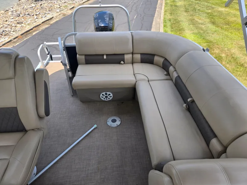 Slide: The Image of 2022 Sun Tracker Party Barge 20 DLX with beige seating and spacious deck layout. - 16