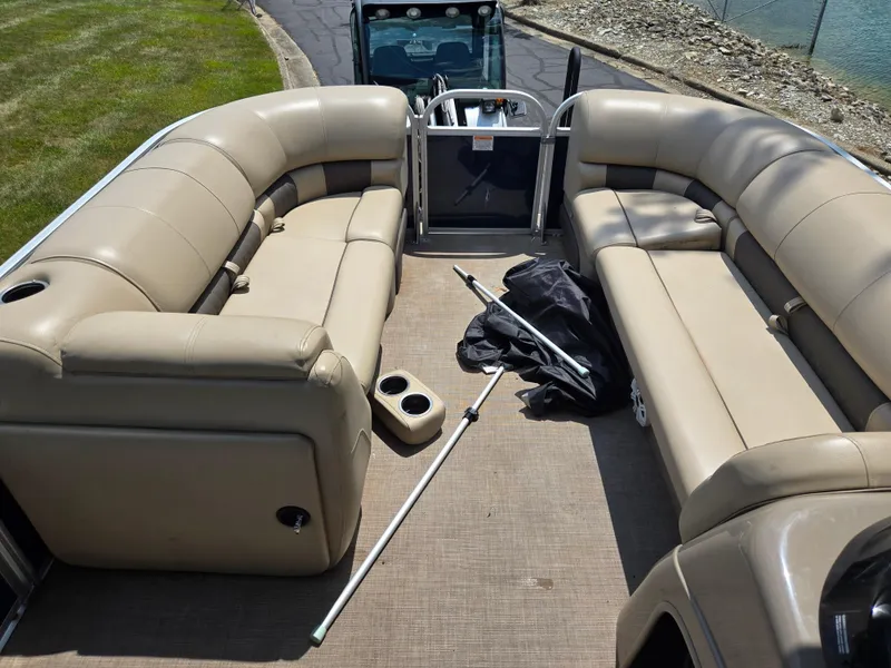 Slide: The Image of 2022 Sun Tracker Party Barge 20 DLX with beige seating and accessories on deck. - 22