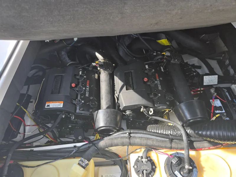 Slide: The Image of Engine compartment of 2021 Scarab 285 ID boat, featuring dual Rotax engines. - 24