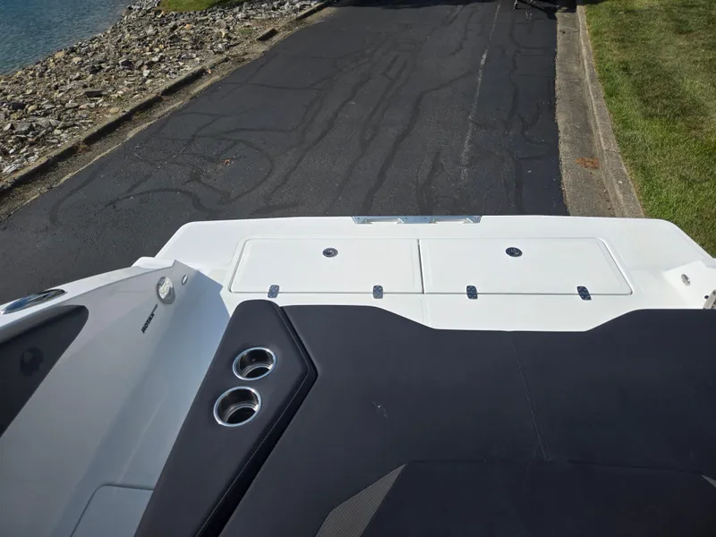 Slide: The Image of Rear view of 2021 Scarab 285 ID boat with cup holders and storage compartments. - 25