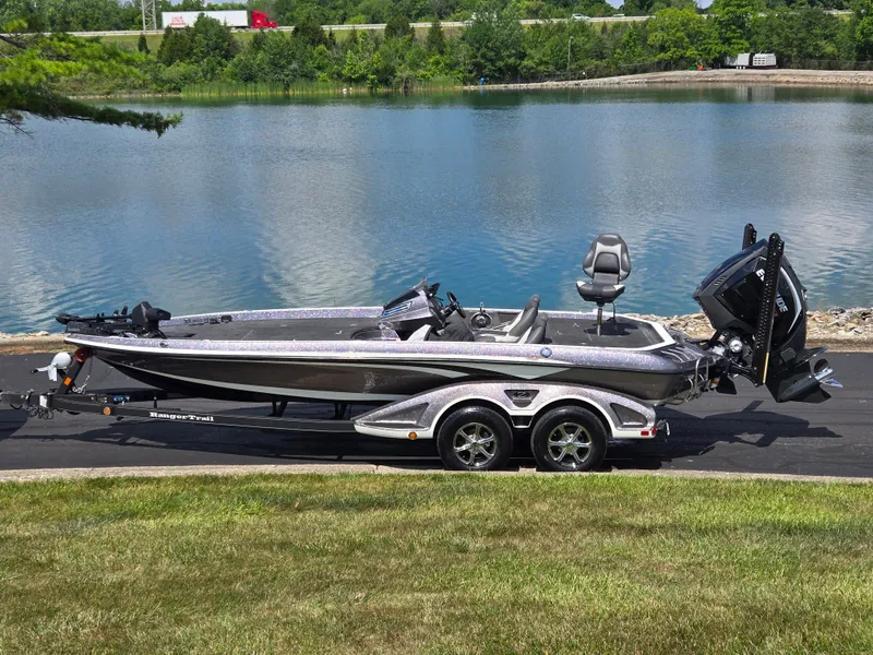 The Image of 2018 Ranger Z520 Comanche Ranger Cup boat on trailer by a lake. - 0