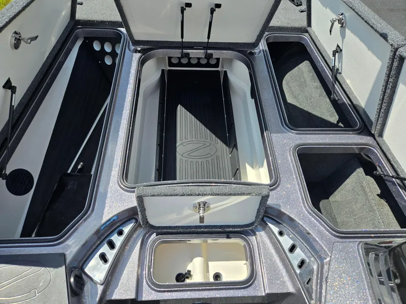Slide: The Image of 2018 Ranger Z520 Comanche Ranger Cup boat storage compartments open, showcasing interior layout. - 14