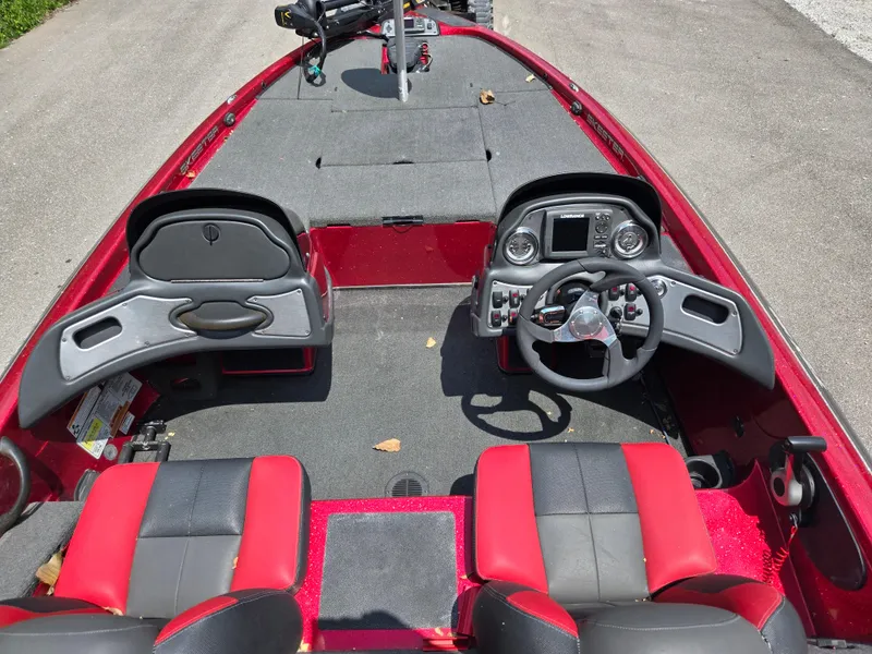 Slide: The Image of 2017 Skeeter TZX 190 boat interior with red and black seating, steering console, and controls. - 10