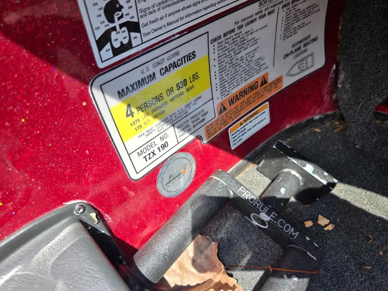 Slide: The Image of 2017 Skeeter TZX 190 boat capacity label, showing maximum 4 persons or 530 lbs. - 13