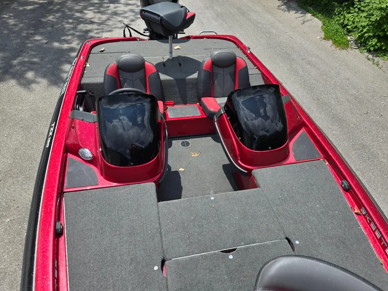 Slide: The Image of 2017 Skeeter TZX 190 boat interior with red and black seating, dual consoles. - 17