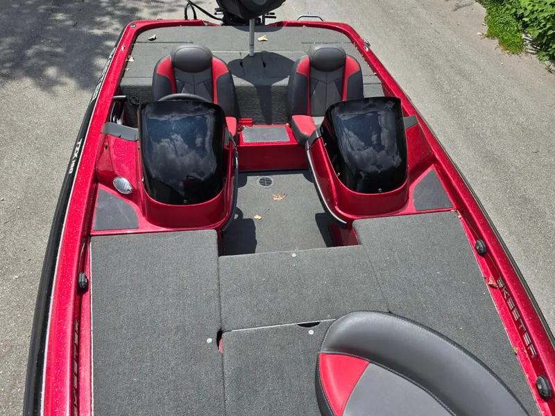 Slide: The Image of 2017 Skeeter TZX 190 boat interior with red and black seating, gray carpet. - 18