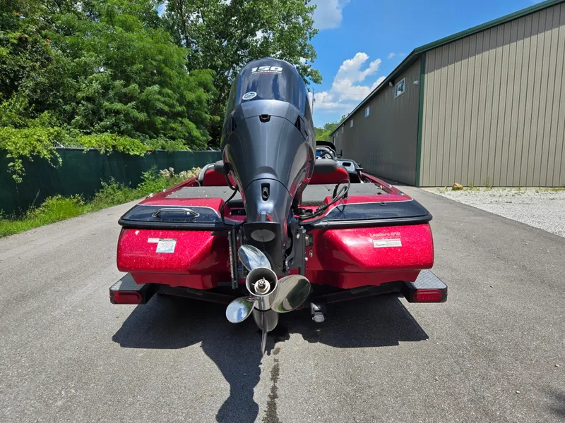 Slide: The Image of 2017 Skeeter TZX 190 boat with outboard motor, parked on a sunny day. - 2