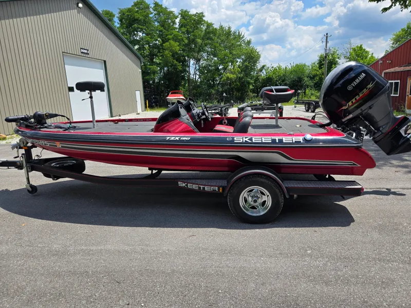Slide: The Image of 2017 Skeeter TZX 190 boat with Yamaha engine, parked outdoors on a sunny day. - 4