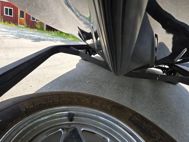 Slide: The Image of 2017 Skeeter TZX 190 boat on trailer, close-up of hull and tire. - 8