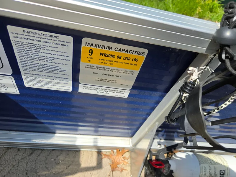 Slide: The Image of 2013 Sun Tracker Party Barge 18 DLX capacity label, showing maximum weight and passenger limits. - 16