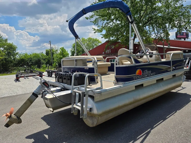Slide: The Image of 2013 Sun Tracker Party Barge 18 DLX pontoon boat parked outdoors. - 3