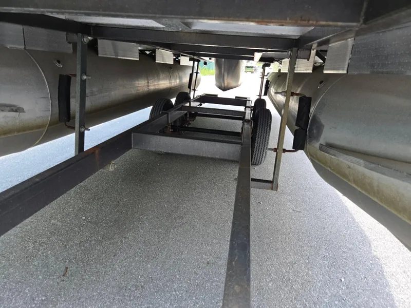 Slide: The Image of Underneath view of a 2013 Sun Tracker Party Barge 18 DLX pontoon boat on a trailer. - 7