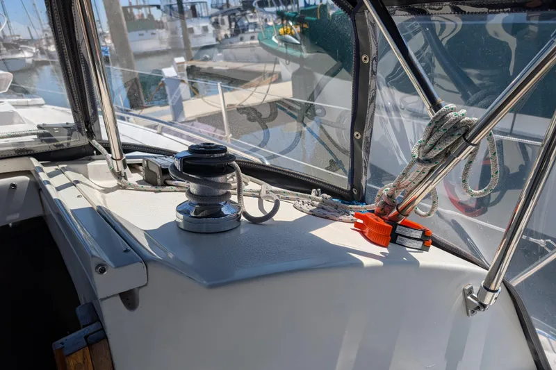 Slide: The Image of Interior starboard view of a 1995 Newport 326 sailboat with winch and ropes. - 12
