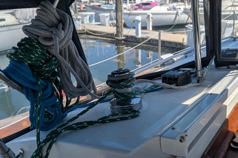 Slide: The Image of Sailboat deck with ropes and winch, Newport 326, 1995 model, docked at marina. - 14