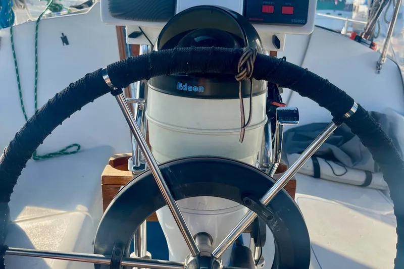 Slide: The Image of Steering wheel of a 1995 Newport 326 sailboat, featuring Edson marine equipment. - 17
