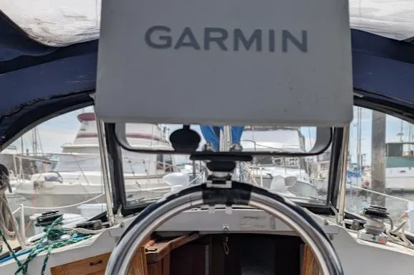 Slide: The Image of Cockpit view of a 1995 Newport 326 sailboat with Garmin navigation system. - 19