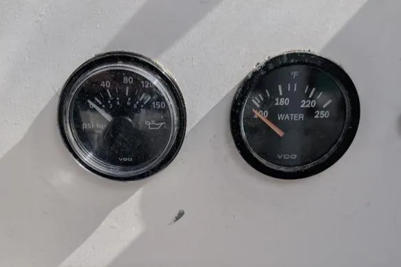 Slide: The Image of Gauges on a 1995 Newport 326, displaying oil pressure and water temperature. - 21