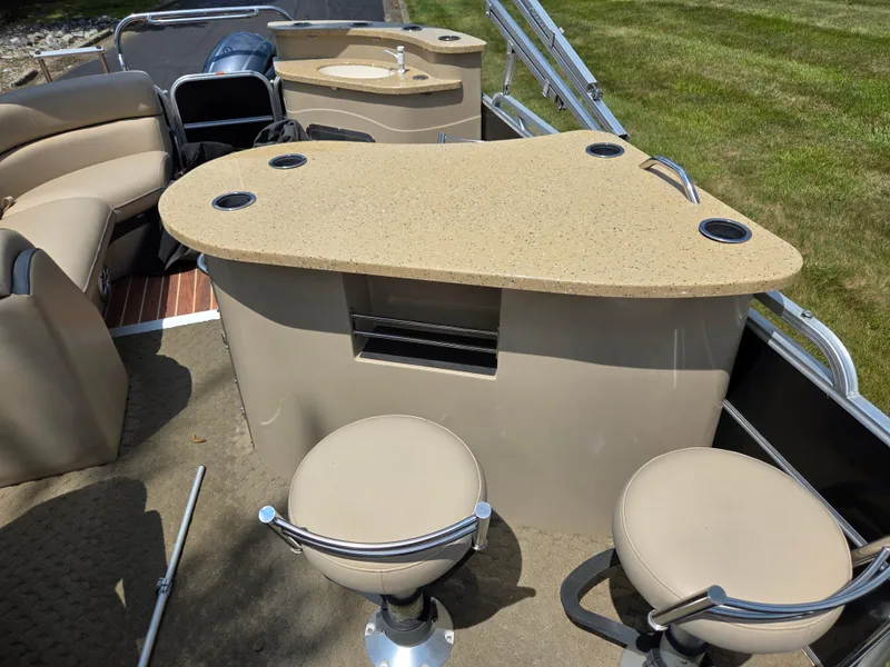Slide: The Image of Luxurious interior of 2014 South Bay 522 E pontoon boat with seating and bar area. - 14