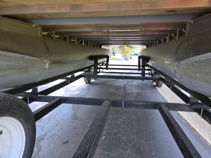 Slide: The Image of Underneath view of a 2014 South Bay 522 E pontoon boat on a trailer. - 7