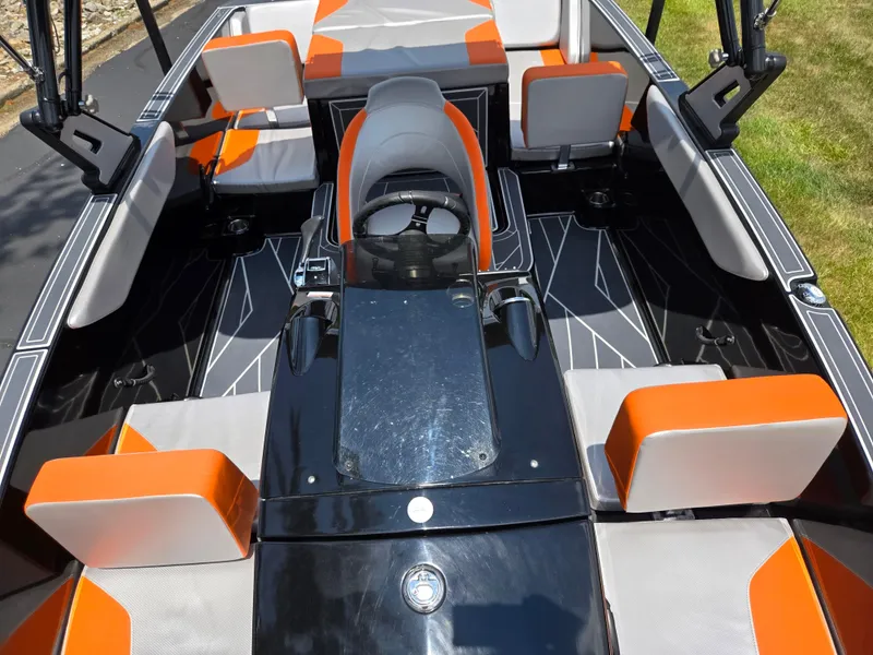 Slide: The Image of 2016 Heyday WT-1 boat interior with orange and gray seating, modern design. - 15