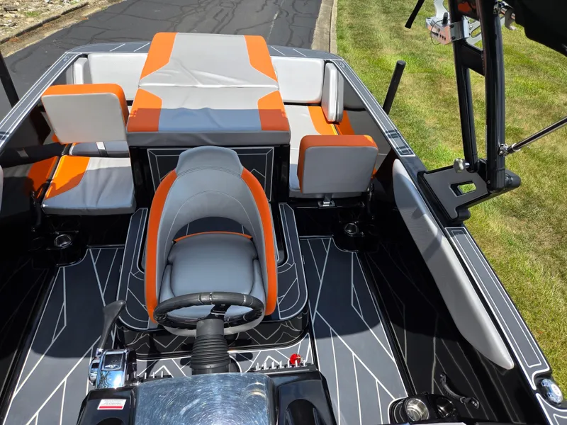 Slide: The Image of 2016 Heyday WT-1 boat interior with orange and gray seating, modern design. - 16