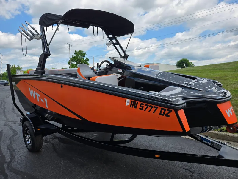 Slide: The Image of 2016 Heyday WT-1 boat with orange and black design on a trailer. - 5