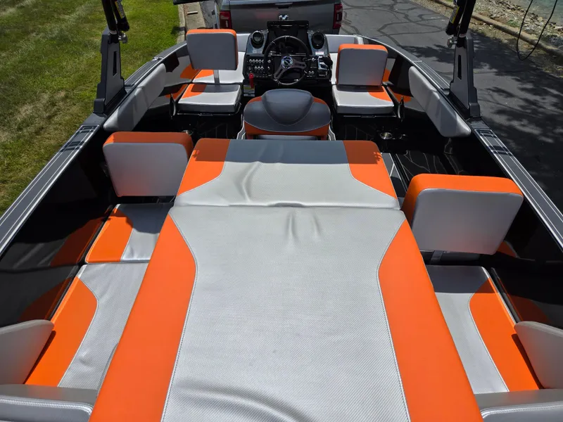 Slide: The Image of 2016 Heyday WT-1 boat interior with orange and gray seating, showcasing modern design. - 9
