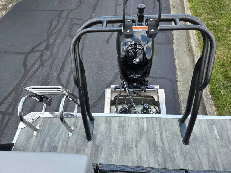 Slide: The Image of 2022 Crest Classic DLX 220 boat with motor and ladder, viewed from above. - 16