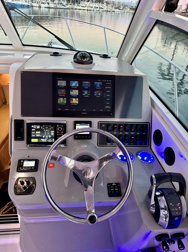 Slide: The Image of Helm of 2014 Boston Whaler 315 Conquest with advanced navigation controls and displays. - 28