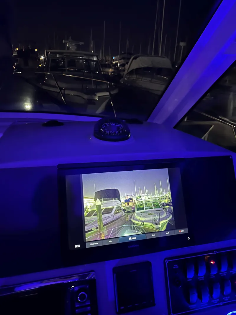 Slide: The Image of Control panel of a 2014 Boston Whaler 315 Conquest at night, with illuminated display. - 30