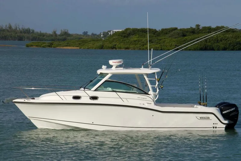 Slide: The Image of Manufacturer Provided Image: 2014 Boston Whaler 315 Conquest boat on calm water. - 37