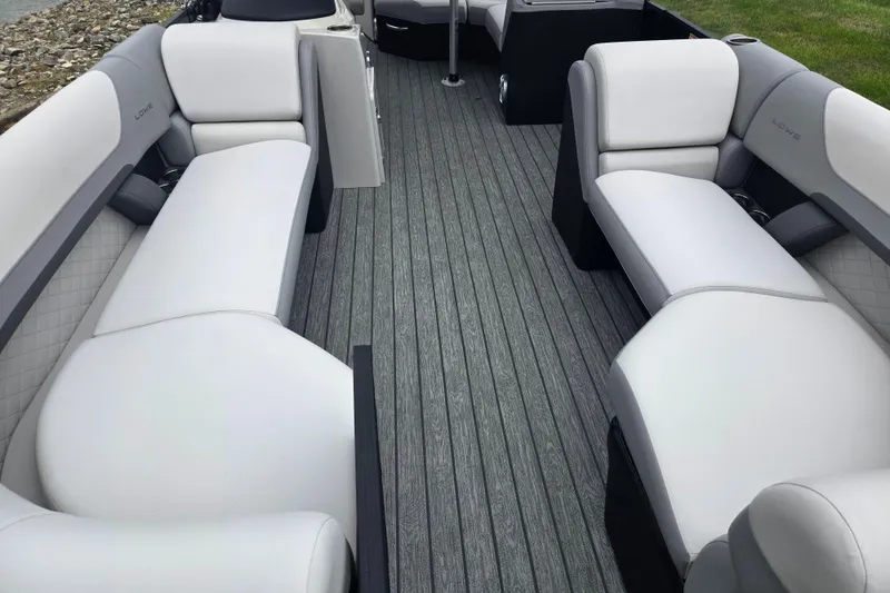Slide: The Image of 2022 Lowe SS 230 CL boat interior with gray and white seating, featuring a sleek design. - 11