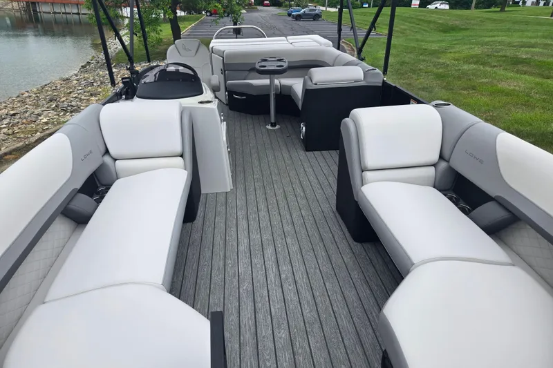 Slide: The Image of 2022 Lowe SS 230 CL pontoon boat with spacious seating and modern design. - 12