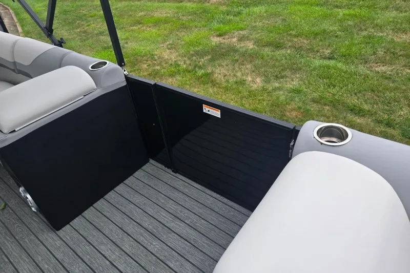 Slide: The Image of 2022 Lowe SS 230 CL boat interior with gray seating and cup holders. - 13