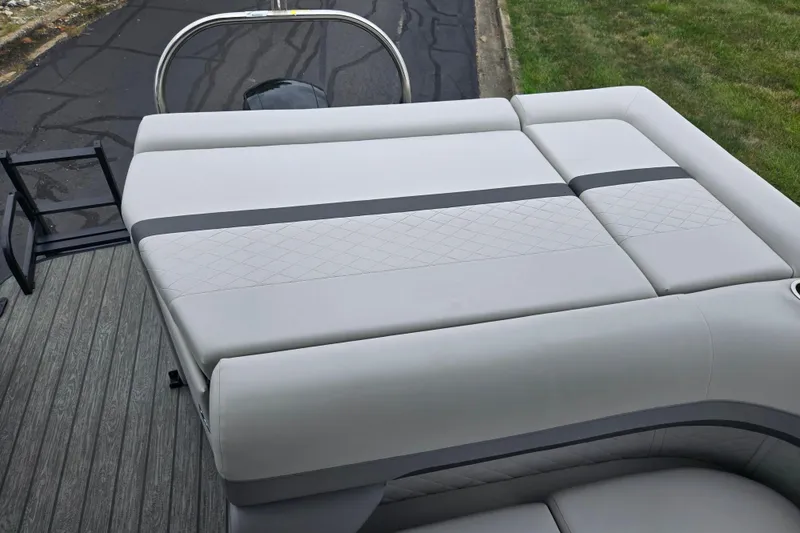 Slide: The Image of 2022 Lowe SS 230 CL boat with cushioned seating and sleek design. - 17