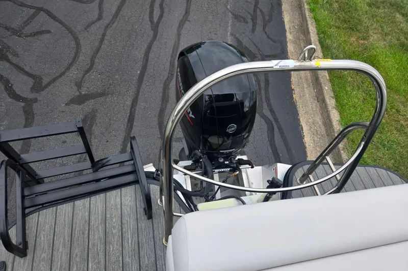 Slide: The Image of 2022 Lowe SS 230 CL boat with Mercury outboard motor and boarding ladder. - 19