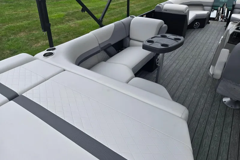 Slide: The Image of 2022 Lowe SS 230 CL pontoon boat with luxurious seating and cup holders. - 20