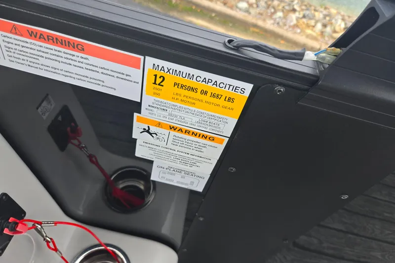 Slide: The Image of Warning labels on 2022 Lowe SS 230 CL boat, indicating maximum capacity and safety information. - 22