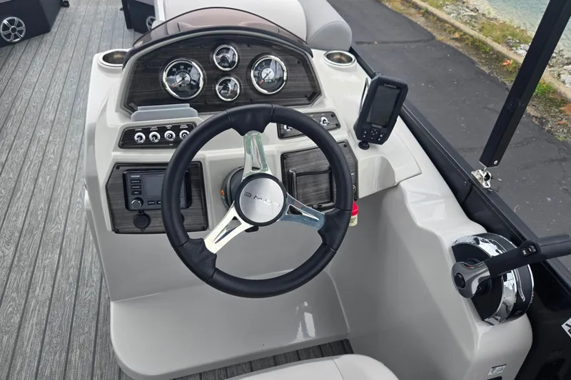 Slide: The Image of Steering console of 2022 Lowe SS 230 CL boat with gauges and controls. - 23